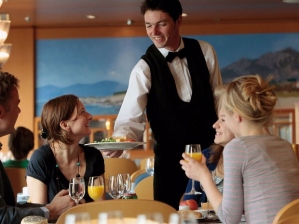 happy waiter at table